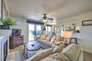 a living room with a couch and a table at Waterfront Condo with Balcony and Dock Access in Horseshoe Bay