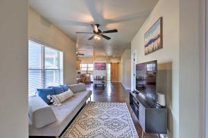 a living room with a couch and a flat screen tv at Modern Retreat 3 Blocks to Dtwn Williams and Rte 66 in Williams