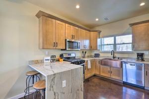 a kitchen with wooden cabinets and a counter top at Modern Boho Retreat 3 Blocks to Dtwn and Rte 66 in Williams