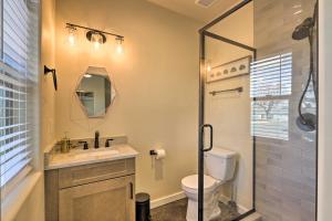 a bathroom with a toilet and a sink and a shower at Modern Retreat 3 Blocks to Dtwn Williams and Rte 66 in Williams +16 photos