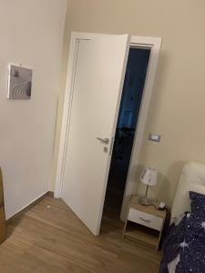 Postel nebo postele na pokoji v ubytování B&B Piano Romano -con parcheggio privato gratuito-