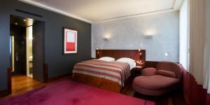Cama o camas de una habitación en Hotel Angleterre