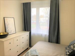 Posteľ alebo postele v izbe v ubytovaní Apartament Blisko Morza i Parku Gdańsk Brzeźno