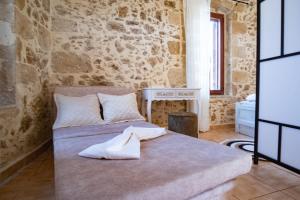 Posteľ alebo postele v izbe v ubytovaní Villa Styliani