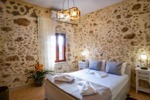 Posteľ alebo postele v izbe v ubytovaní Villa Styliani