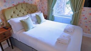 Llit o llits en una habitació de 23 St Mary's
