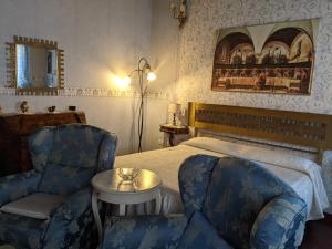 A bed or beds in a room at D'Elite Room & Breakfast
