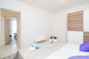 Postel nebo postele na pokoji v ubytování Apartment Cvjetković + 31 fotografií