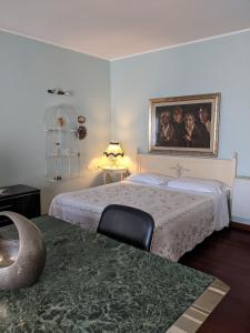 A bed or beds in a room at D'Elite Room & Breakfast