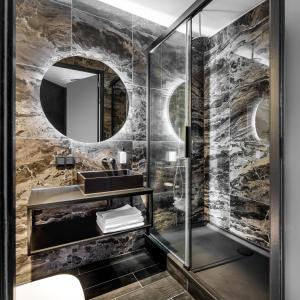 a bathroom with a sink and a mirror at Le Marin Boutique Hotel in Rotterdam