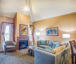 a living room with a couch and a fireplace at WorldMark Branson in Branson