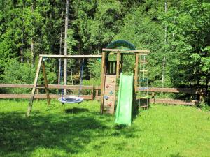 a playground in a field with a slide at Reiterhof Finkenmuehle Fewo Boris in Weißenstadt