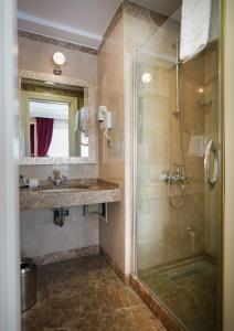 a bathroom with a shower and a sink at Hotel Gritti Pera & Spa in Istanbul +97 photos