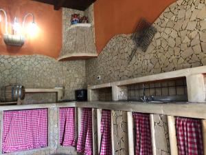 a kitchen with a sink and a counter top at Oasi Bochini in Avola