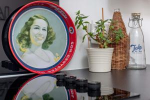 a plate on a table with a picture of a woman at Redlands Country Lodge Apartments with Hot Tubs in Ladybank