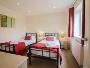 Ένα ή περισσότερα κρεβάτια σε δωμάτιο στο Cholwell Barn Apartment