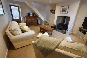 A seating area at Renovated cosy cottage within Cranborne Chase