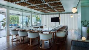 a long dining room with a long table and chairs at InterContinental Cascais-Estoril by IHG in Estoril