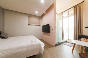 Μια τηλεόραση ή/και κέντρο ψυχαγωγίας στο Mu sun Villa 慕山休閒包棟民宿 宜蘭縣民宿2060號