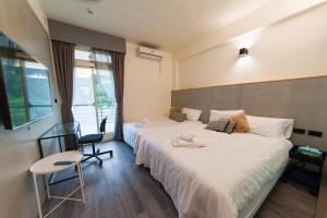 Ένα ή περισσότερα κρεβάτια σε δωμάτιο στο Mu sun Villa 慕山休閒包棟民宿 宜蘭縣民宿2060號