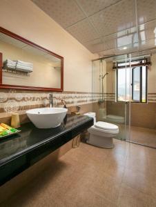 a bathroom with a sink and a toilet at Sapa Mountain Queen House in Sa Pa