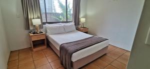 Postel nebo postele na pokoji v ubytování St Tropez Resort