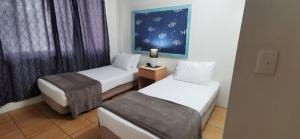 Postel nebo postele na pokoji v ubytování St Tropez Resort