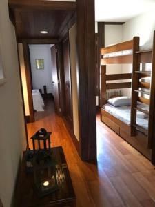 Łóżko lub łóżka piętrowe w pokoju w obiekcie T1 Troia Resort - Praia Mar