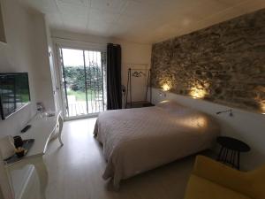 Postel nebo postele na pokoji v ubytování La Bastide des Mûriers