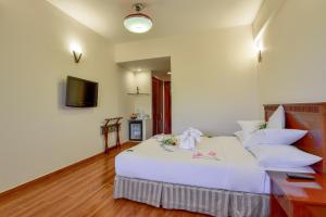 Postel nebo postele na pokoji v ubytování Khách sạn Park Hotel Dalat