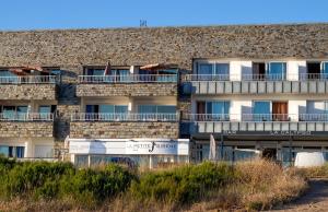 an external view of a building with balconies at Hôtel La Petite Sirène Quiberon in Quiberon