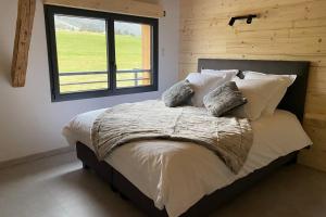 Säng eller sängar i ett rum på Gîte cosy, au calme entre Genève et Annecy