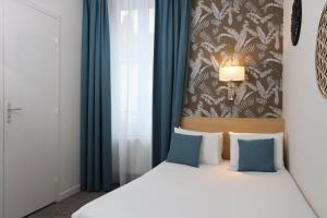 Cama ou camas em um quarto em Hotel Continental