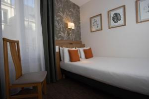 Cama ou camas em um quarto em Hotel Continental
