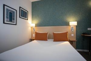 Cama ou camas em um quarto em Hotel Continental