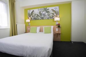 Cama ou camas em um quarto em Hotel Continental
