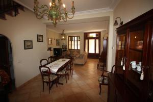a living room with a table and chairs at Casa Carrer de Bonany in Sóller