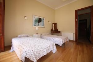 מיטה או מיטות בחדר ב-Casa Carrer de Bonany