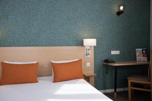 Cama ou camas em um quarto em Hotel Continental