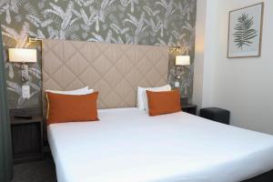 Cama ou camas em um quarto em Hotel Continental