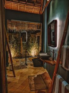 a bathroom with a sink and a mirror at Amihan Beach Cabanas in Bantayan Island
