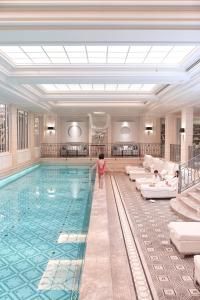 
a large swimming pool in a hotel room at Four Seasons Hotel George V Paris in Paris
