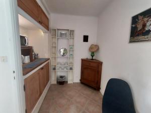 a kitchen with a sink and a counter in a room at Villa Le Sud in Les Issambres