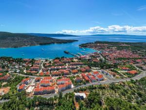 an aerial view of a town next to a body of water at Luxury Landing in Cres