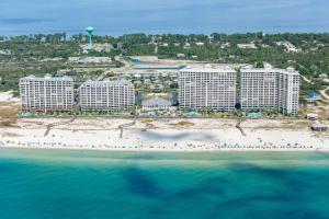 an aerial view of a resort on a beach at The Beach Club Resort and Spa IV in Gulf Highlands
