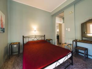 A bed or beds in a room at Filoxenia Hotel