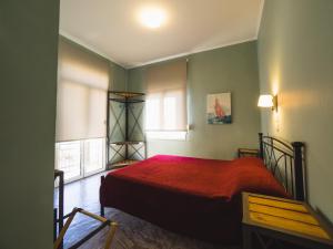 A bed or beds in a room at Filoxenia Hotel