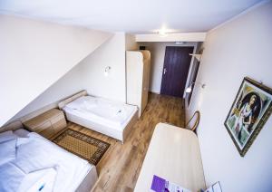 Postel nebo postele na pokoji v ubytování Hotel 4