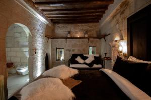 A bed or beds in a room at Sato Cave Hotel