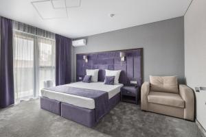 Ένα ή περισσότερα κρεβάτια σε δωμάτιο στο Hotel Vogue